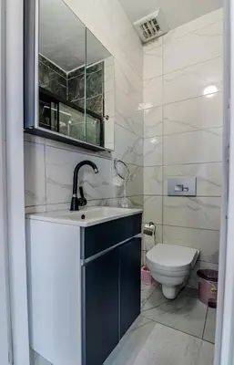 a bathroom with a sink and a toilet at İstanbul Airport Holiday Beach Hotel in Arnavutköy