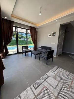 a living room with two chairs and a couch at Villa in nature in Sapanca