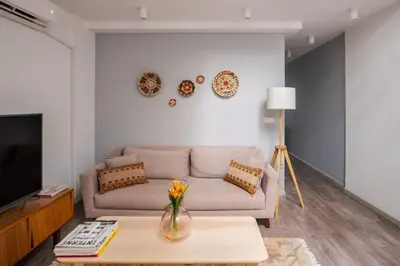 a living room with a couch and a table at Amazing Luxury Duplex High Ceiling Patio! #403 in Istanbul