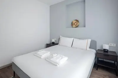 a white bed with two white towels on it at Cute Intimate Airy 1Bed1Bath Nisantasi Home! #405 in Istanbul