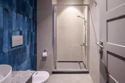 a bathroom with a shower with a toilet and a sink at Cute Intimate Airy 1Bed1Bath Nisantasi Home! #405 in Istanbul