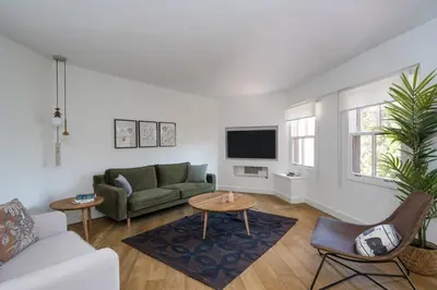 a living room with a couch and a table at Beautiful Modern Bright 2BD Patio Duplex #179 in Istanbul