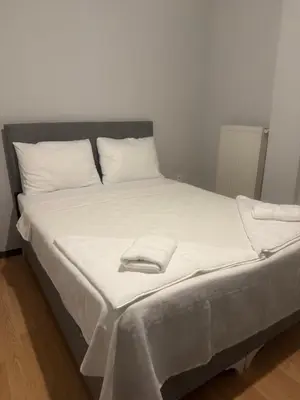 a bed with white sheets and pillows on it at Disa - Hotel Galata in Istanbul