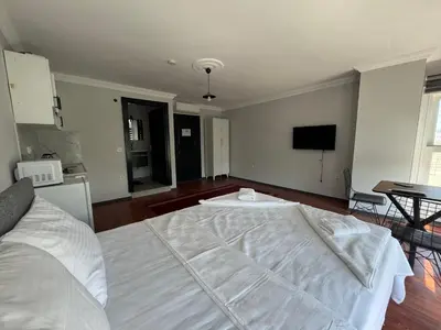 a bedroom with a large white bed in a room at Mehmet Paşa Konağı in Istanbul