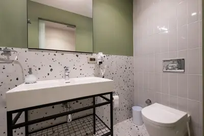 a bathroom with a sink and a toilet and a mirror at Galata 21 in Istanbul