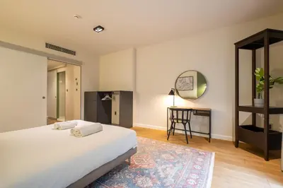 a bedroom with a bed and a table and a mirror at Galata 21 in Istanbul