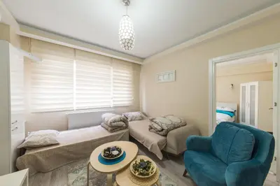 a living room with a couch and a chair at White Rose Apart in Istanbul