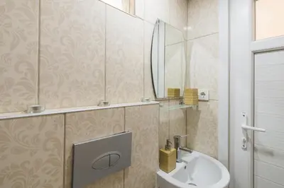 a bathroom with a sink and a mirror at White Rose Apart in Istanbul