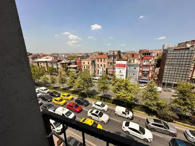 a view of a parking lot with cars in a city at Lavina Apartment in Istanbul