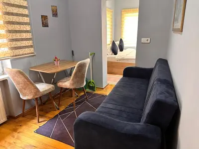 a living room with a couch and a table at Lavina Apartment in Istanbul