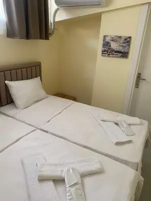 a bedroom with two beds with towels on them at Muhterem Hanım Konağı in Istanbul