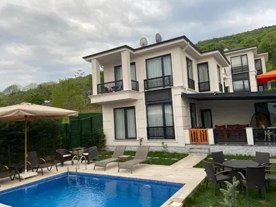a house with a swimming pool in front of it at Villa منظر in Sapanca