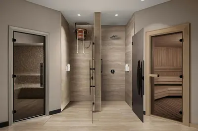 a walk in shower with a glass door in a bathroom at Marriott Executive Apartments Istanbul Tema World in Istanbul
