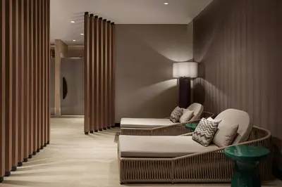 a living room with two chairs and a couch at Marriott Executive Apartments Istanbul Tema World in Istanbul