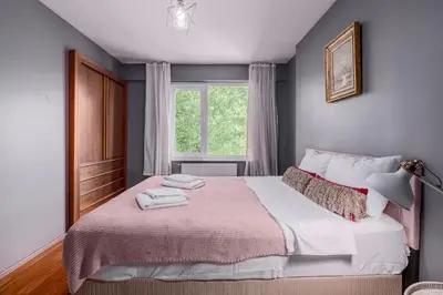 a bedroom with a large bed and a window at Duplex Flat w Panoramic Bosphorus View and Terrace in Istanbul