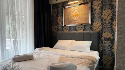 a bed sitting in a bedroom with a window at Tuzla Sahil Enjoy Hotel in Tuzla