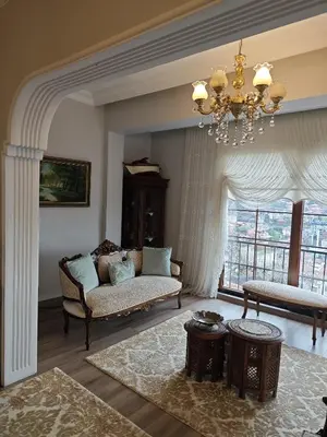 a living room with a couch and a chandelier at An İstanbul tale, İstanbul dream,bosphorus villa in Istanbul