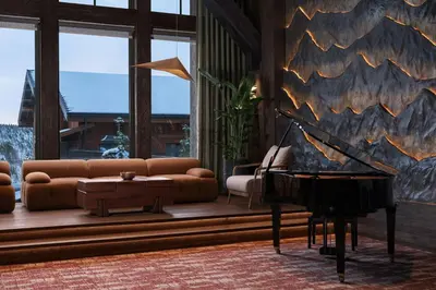a living room with a couch and a piano at Ceylan Splend'or Uludag, Autograph Collection