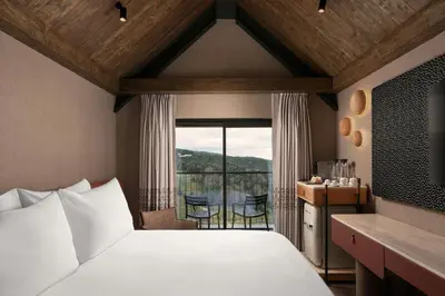 a hotel room with a bed and a balcony at Ceylan Splend'or Uludag, Autograph Collection