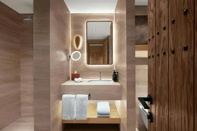 a bathroom with a sink and a mirror at Ceylan Splend'or Uludag, Autograph Collection