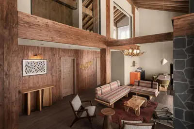 a living room with wooden walls and wooden furniture at Ceylan Splend'or Uludag, Autograph Collection