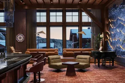 a lobby with a living room with a piano at Ceylan Splend'or Uludag, Autograph Collection