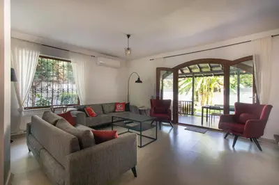 a living room with a couch and chairs and a table at 4BR all AC Pool BBQ Garden on Bagdat Ave Kirkpinar in Sapanca