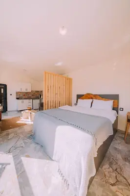 a bedroom with a large white bed in a room at Monk Living Space in Kocaeli