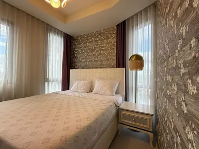 a bedroom with a bed and a window at new luxury comfortable apartment in Istanbul