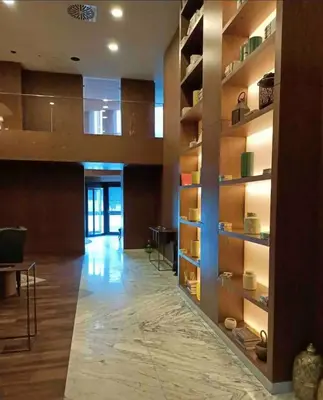 a large room with wooden shelves and a hallway at new luxury comfortable apartment in Istanbul