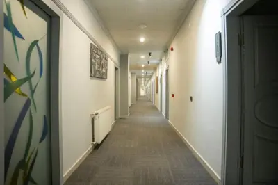 a hallway of an office building with a long corridor at Altınova Hotel Sakarya in Serdivan