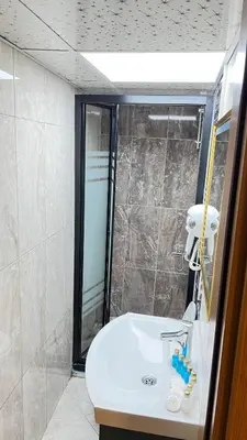 a bathroom with a sink and a shower at crown taksim hotel in Istanbul