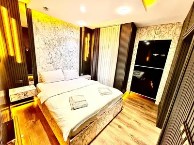 a bedroom with a large bed in a room at Taksim Luxury Arcadia Hotel in Istanbul