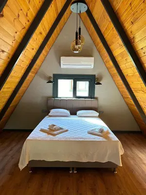 a bedroom with a bed in a attic at Finymoco in Kartepe