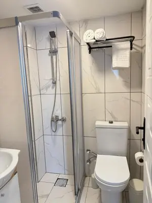 a bathroom with a shower and a toilet at Casafra in Istanbul
