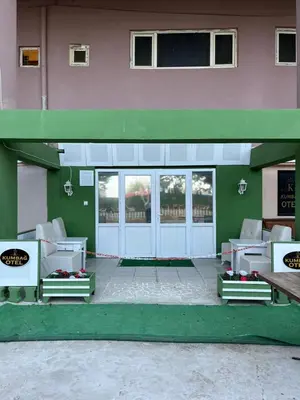 a front door of a building with white at Kumbağ Otel in Kumbağ