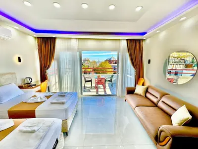 a hotel room with a bed and a couch at Hagia Sophia Palace Hotel in Istanbul
