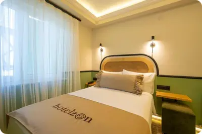 a hotel room with a bed with a nautilus at Hotel Zon in Serdivan