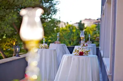 a row of tables with white table cloths on them at The Hera Premium Hotels in Istanbul