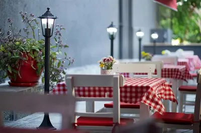 a table and chairs with a red and white checkered table cloth at The Hera Premium Hotels in Istanbul