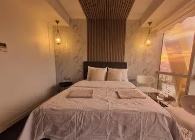 a bedroom with a large bed with two pillows at Dap Vazo Kule Rezidansta Konaklama Hizmeti in Istanbul