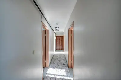 a hallway with two doors and a mirror at Par Konaklama in Istanbul