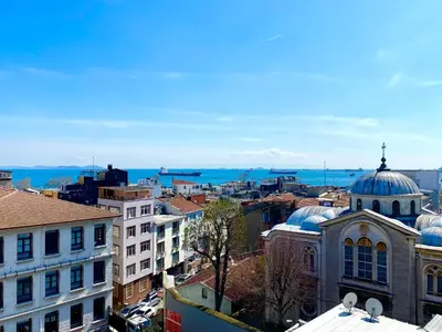 a view of a city with buildings and the ocean at Santefe Hotel in Istanbul