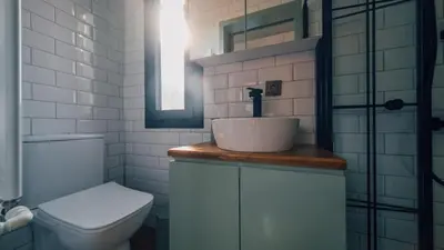 a white bathroom with a sink and a toilet at The Now Sapanca Suites in Sapanca