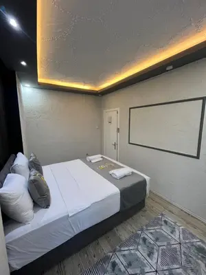 a bedroom with a large bed in a room at Poyraz suit in Bursa