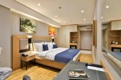 a hotel room with a bed and a desk at Istanbul Taksim Pera Star Hotel - Istiklal Street in Istanbul