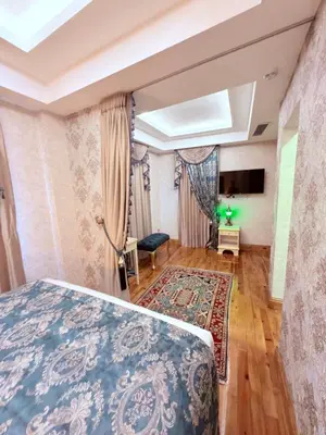 a bedroom with a bed and a tv in a room at Sultan Suites Hotel in Istanbul