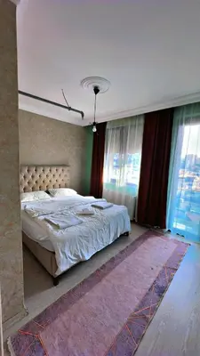 a bedroom with a large bed and a large window at 216 Blue Life in Istanbul