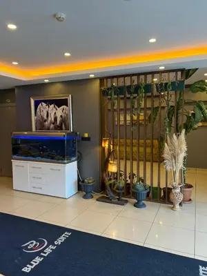 a lobby with a large aquarium in a building at 216 Blue Life in Istanbul