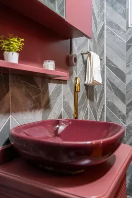a bathroom with a red sink on a red counter at Mercan Apartments Balat-The Hidden Terrace in Istanbul
